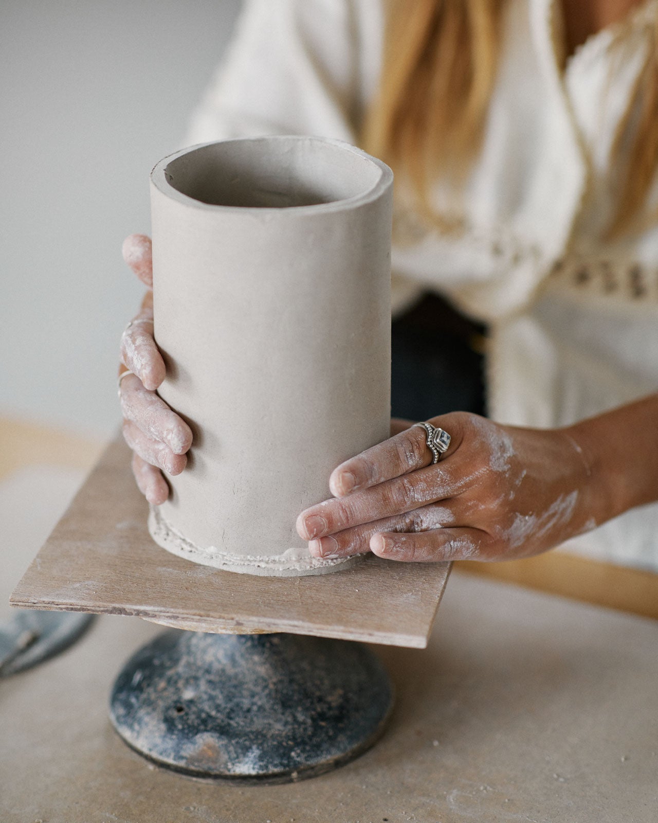 Instructor demonstrating vase painting techniques