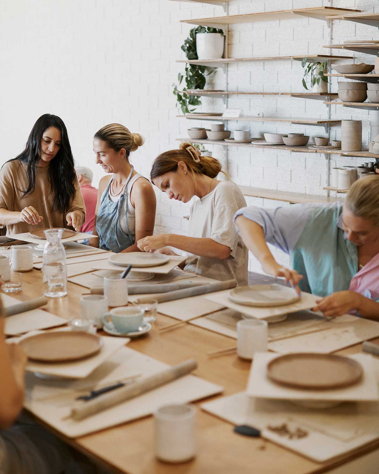 Student shaping bowl for handmade breakfast set