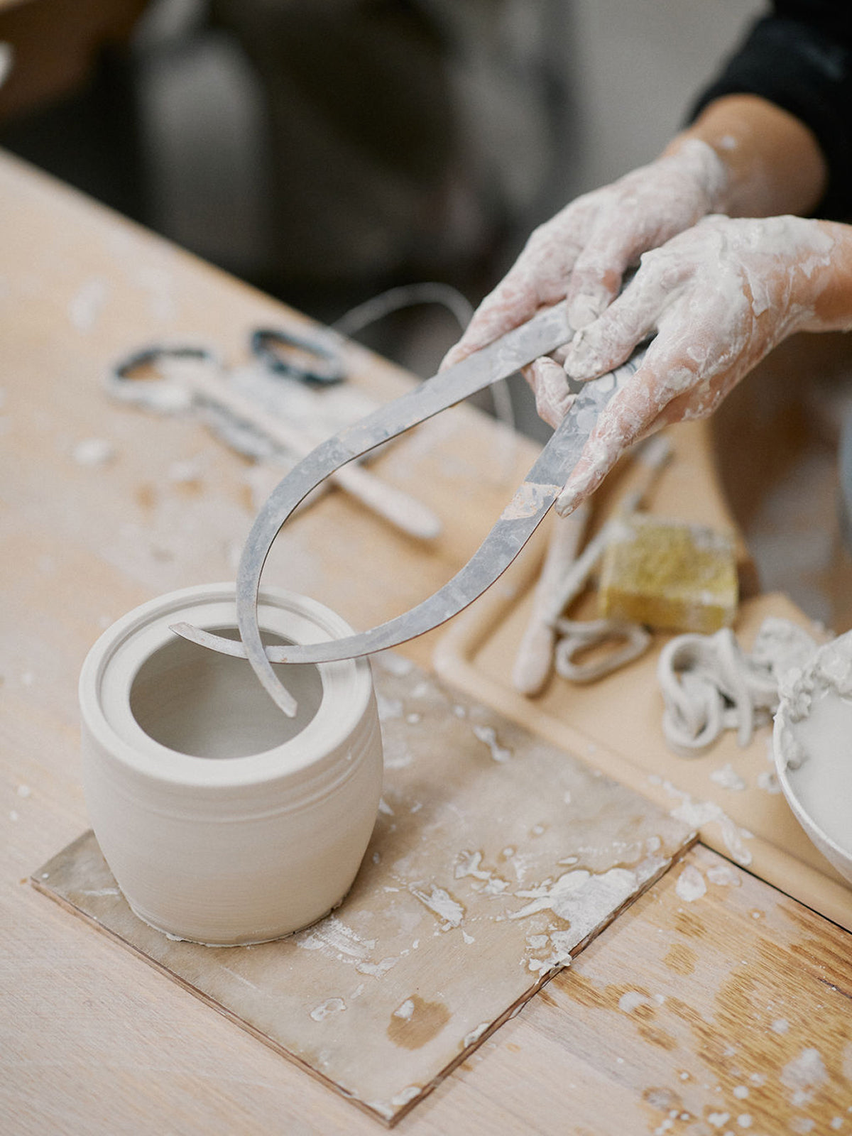 Variety of pottery projects from mixed technique class