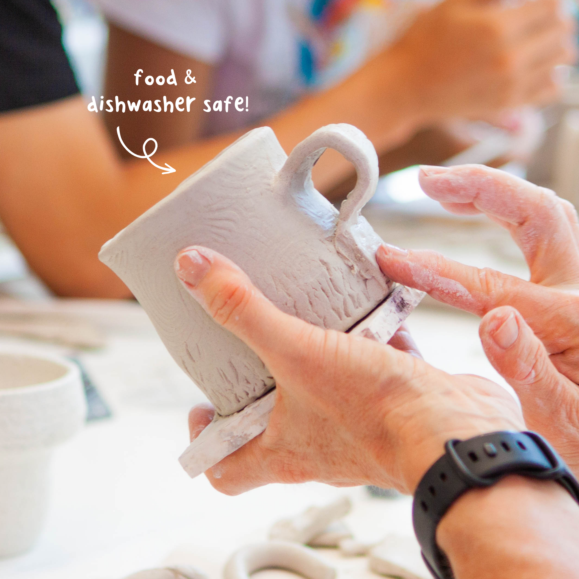 Instructor demonstrating mug-making techniques