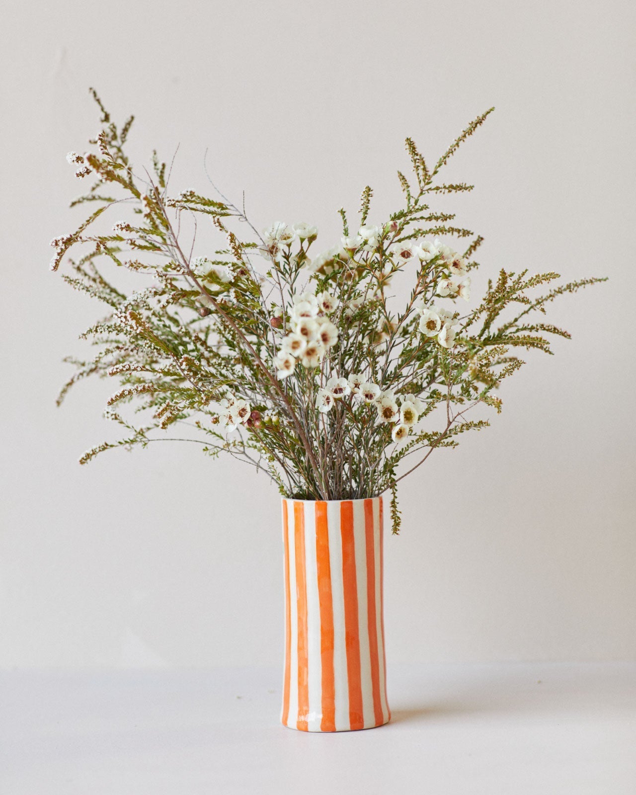 Colorfully painted ceramic vases on display