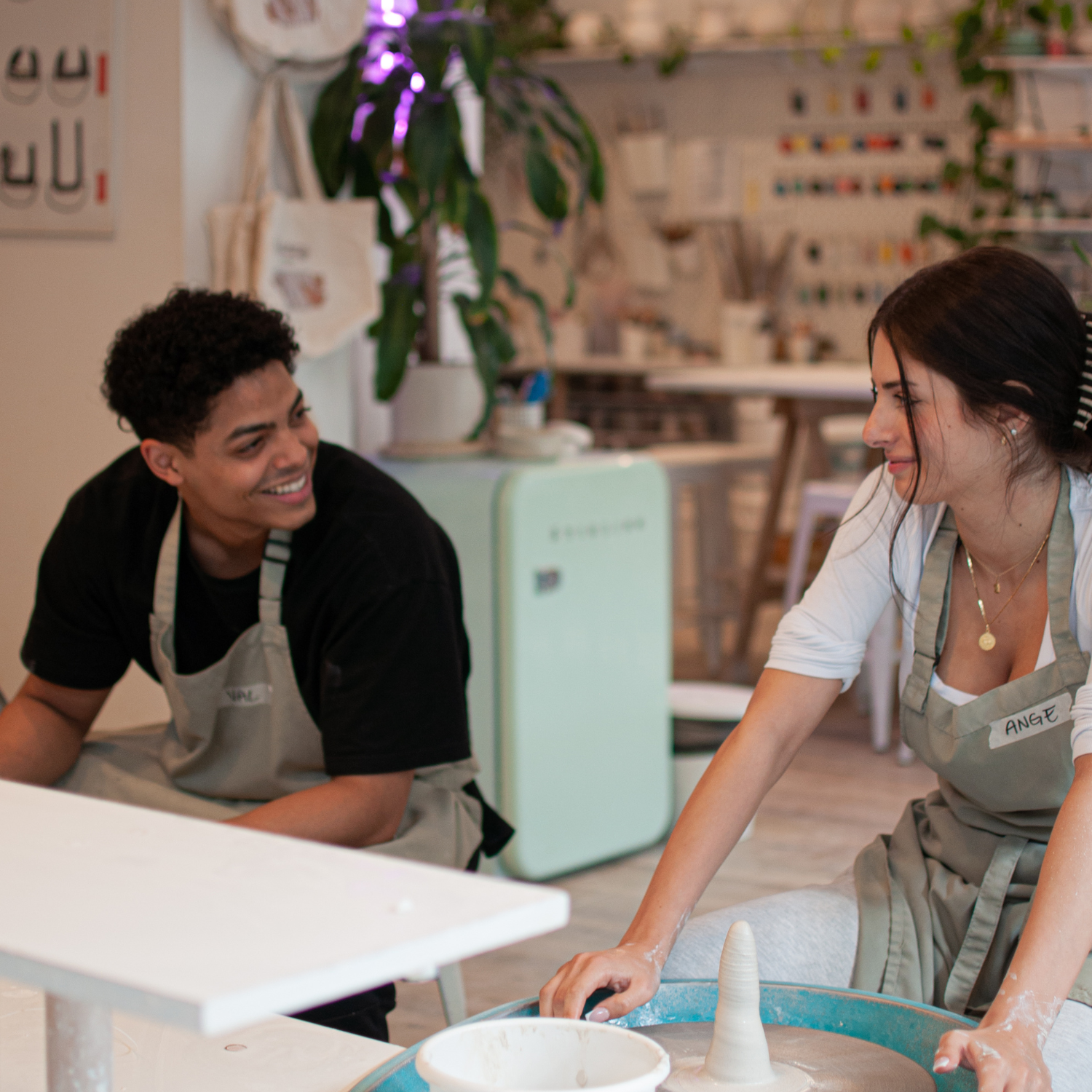 Instructor demonstrating wheel techniques to couples