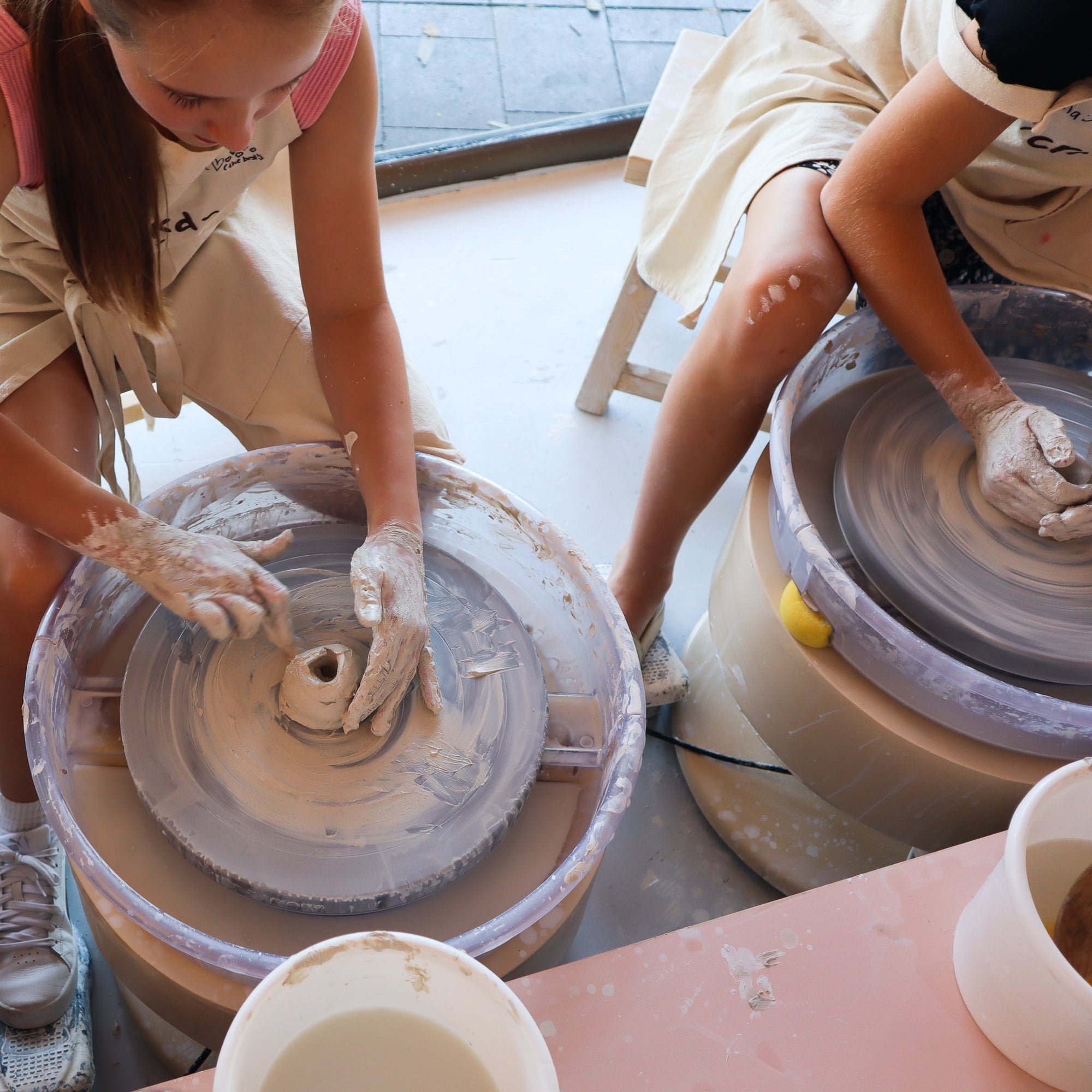 Kids engaged in hand building clay projects