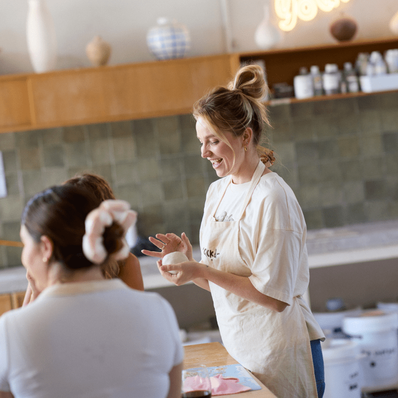 Guests making cheeky handmade mugs during the Crockd Booty Mugs and Margies pottery class.