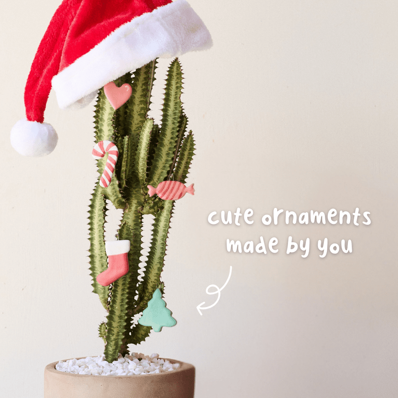 People making and painting handmade ceramic Christmas ornaments during a pottery workshop.