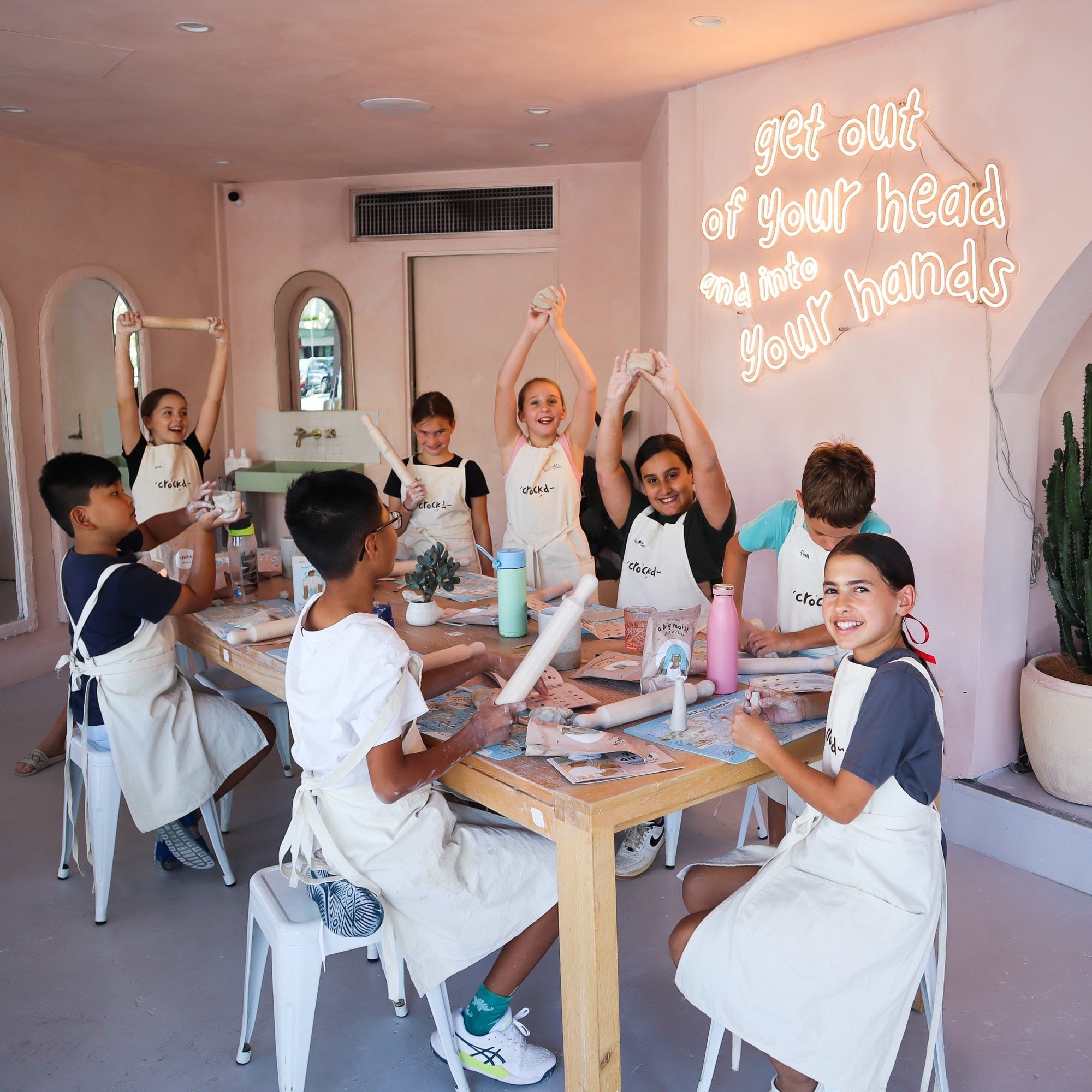 Children starting school holiday pottery workshop