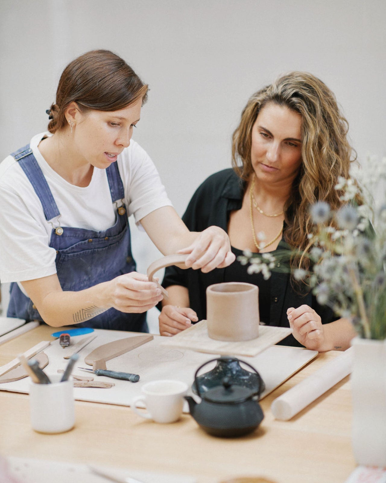 Display of finished beginner hand-built ceramic pieces